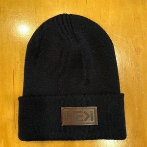 Black beanie hat. Brand is He>i